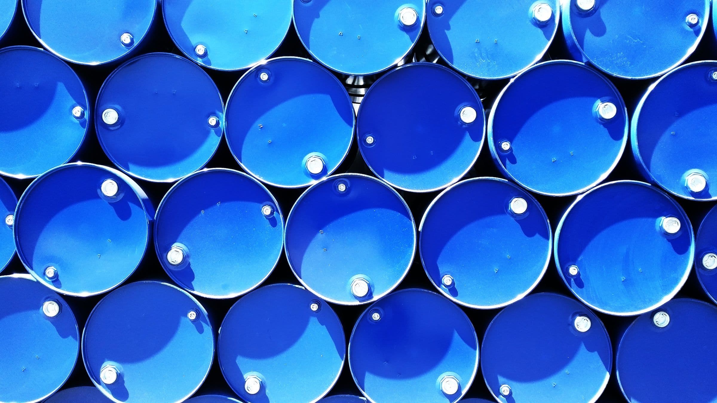 Stacked industrial drums representative of dangerous goods packaging