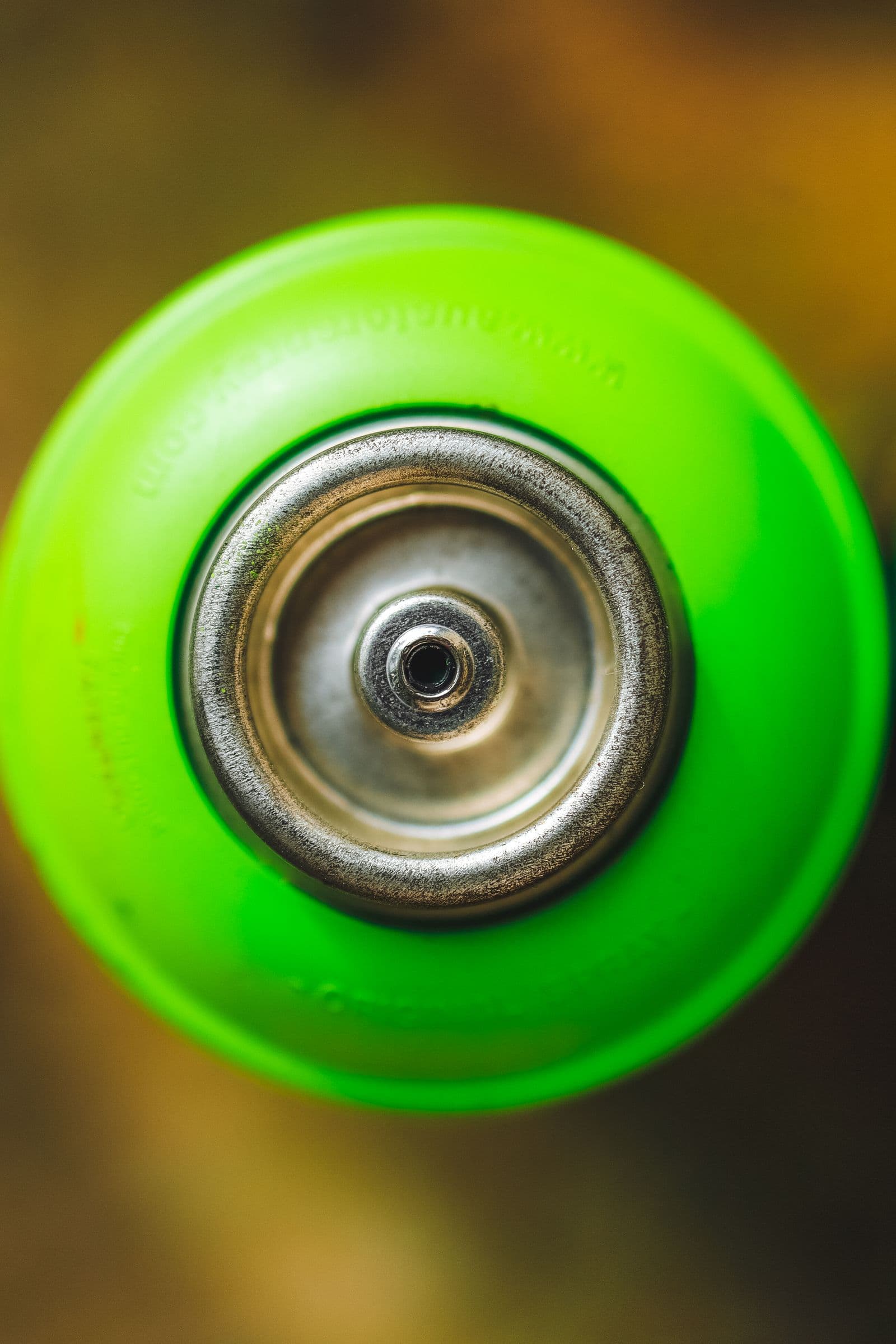 Close-up of an aerosol can valve and actuation mechanism