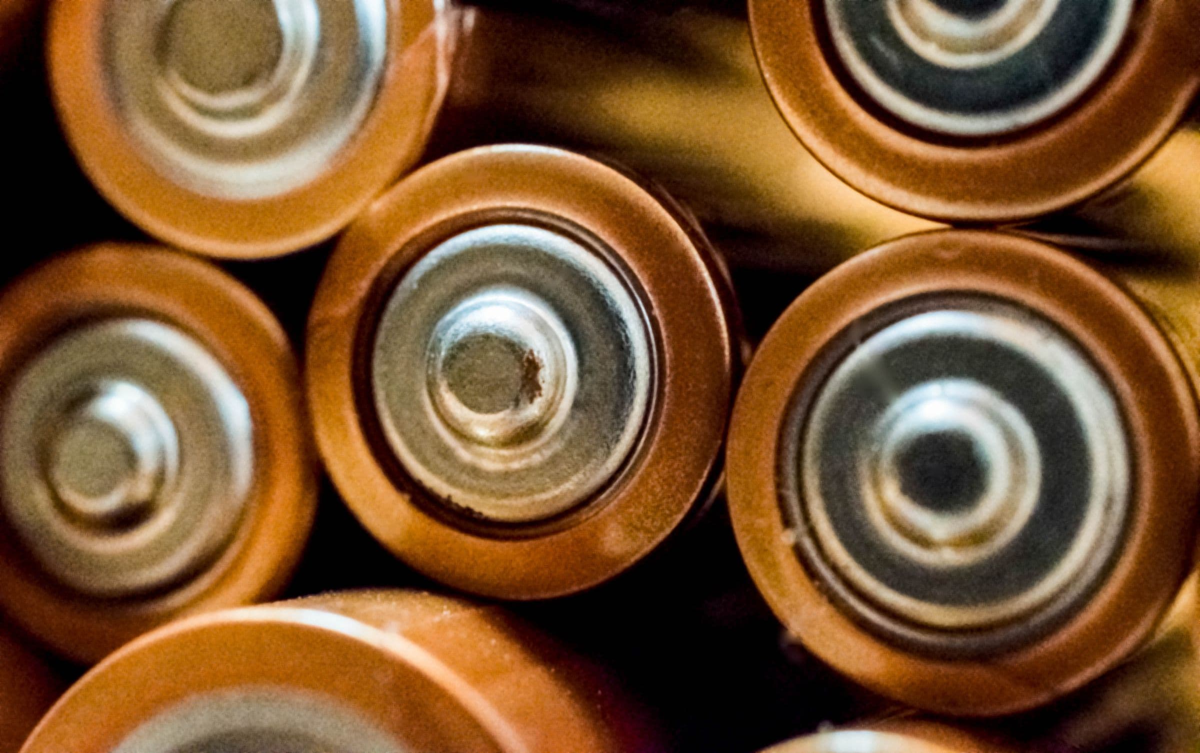 Macro view of cylindrical battery cell terminals — generic representative imagery, not a depiction of a specific chemistry, brand or Falcon test sample