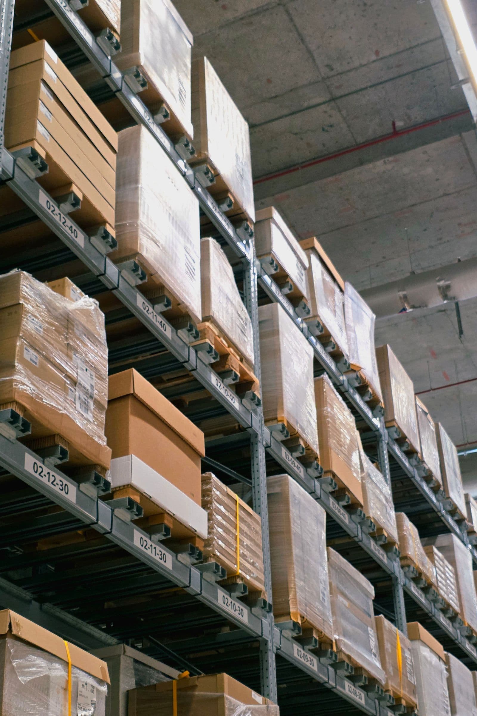Palletised freight on high-bay warehouse racking, representative of a distribution environment